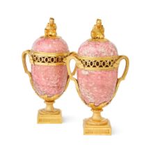A pair of ormolu mounted pink granite pot-pourri vases in the Louis XVI style, part late 18th ce...