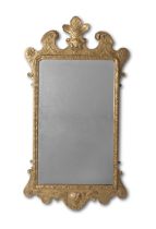 A George II giltwood and gilt gesso mirror Circa 1730, the cresting later