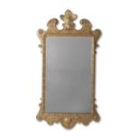 A George II giltwood and gilt gesso mirror Circa 1730, the cresting later