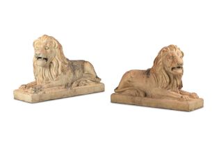 A pair of substantial late 19th century moulded terracotta models of recumbent lions by J&M Crai...