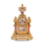 A late 19th century French gilt spelter and porcelain inset mantel clock the movement with Japy ...