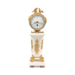 An early 20th century French gilt bronze and white marble boudoir timepiece