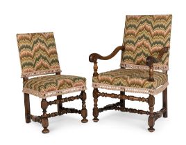 A matched set of twelve walnut dining chairseight chairs evidently ranging in date from the 17th...