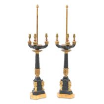 A pair of gilt and patinated bronze three light candelabra in the Charles X style, probably Fre...