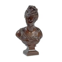 After Jean Goujon (French, 1510-1567): A late 19th century French patinated bronze bust of Diane...