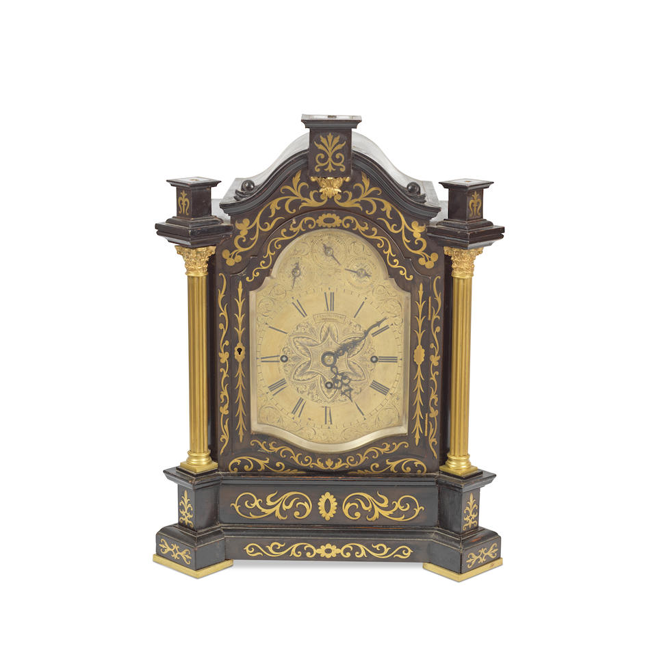 A late 19th century brass mounted and inlaid ebonised chiming bracket/table clock the dial signe...