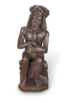A Northern European carved oak figure of Christ on the Cold Stone probably French, late 15th/ear...