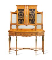 A late Victorian Sheraton revival satinwood, purplewood line-inlaid and polychrome decorated cab...
