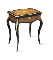 A French 19th century tortoiseshell and brass 'Boulle' marquetry ebony table a ouvrage or dressi...