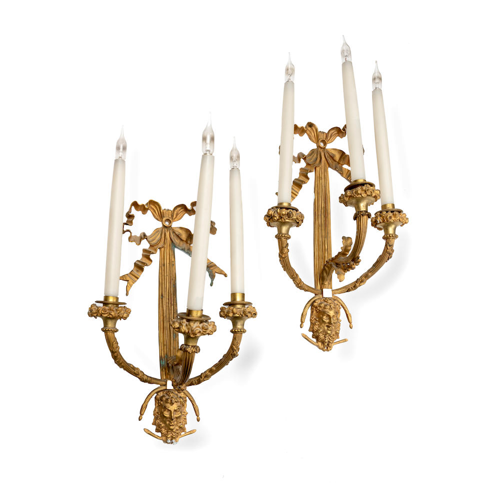 A pair of early 20th century French gilt bronze three branch wall appliques in the Louis XVI sty...