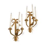 A pair of early 20th century French gilt bronze three branch wall appliques in the Louis XVI sty...