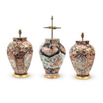 A pair of Japanese Imari pattern porcelain vases and a similar larger Japanese Imari porcelain v...