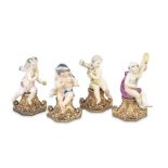 A set of four German porcelain figures of seated putti emblematic of the Seasons mounted on Port...