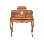 An early Victorian porcelain and ormolu mounted tulipwood and kingwood bonheur du jour in the Fr...