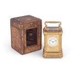 A late 19th / early 20th century French gilt brass carriage clock with push repeat with original...