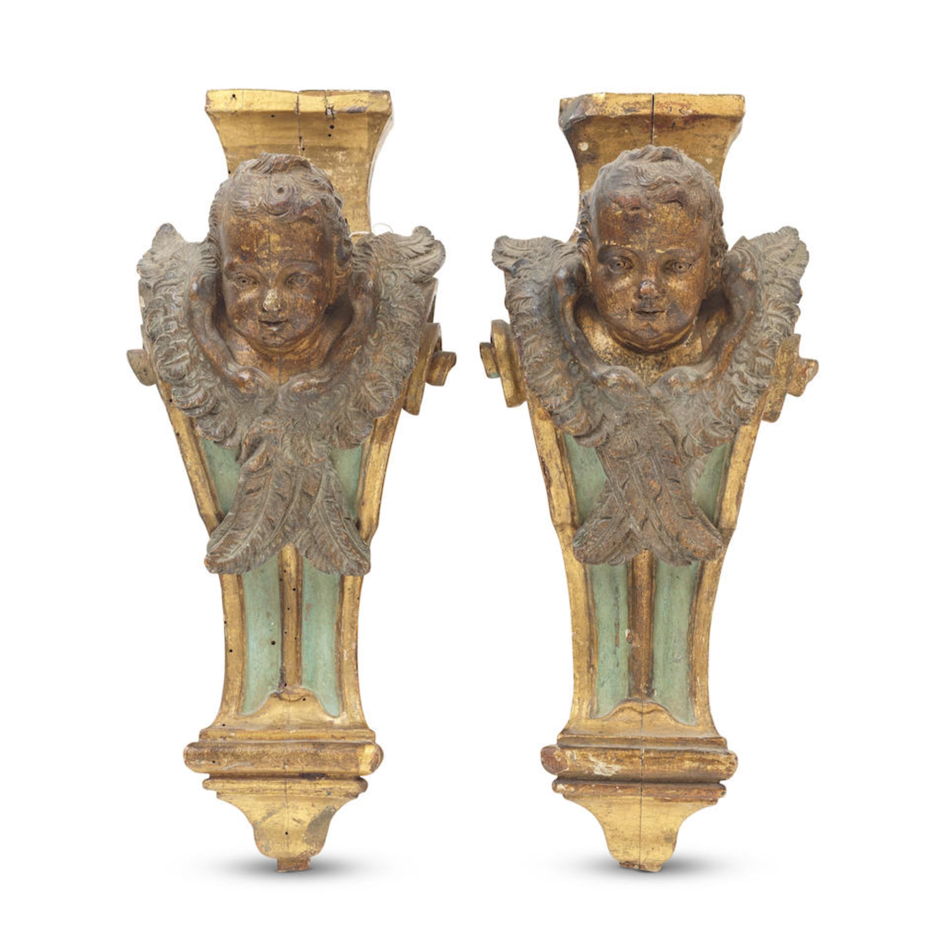 A pair of 19th century carved and painted and parcel gilt figural corbel mounts in the Baroque s...