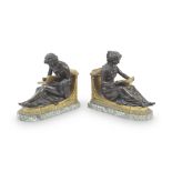 A pair of first half 19th century French patinated and gilt bronze figural clock mounts later a...