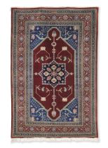 A signed Qum carpet Central Persia, 203m x 132cm