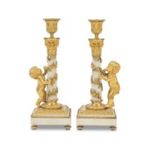 A pair of 19th century gilt bronze mounted white marble figural candlesticks in the Louis XVI s...