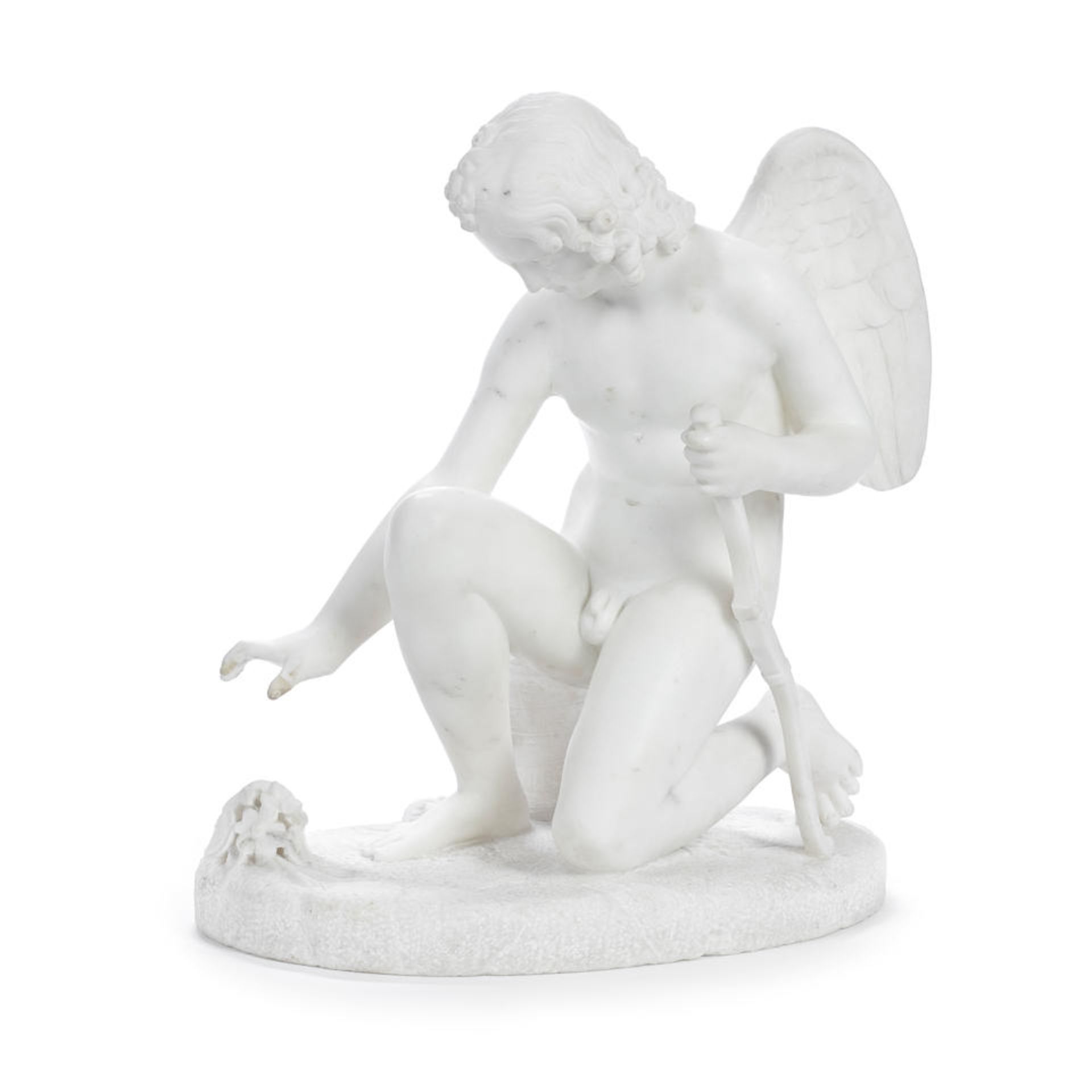 A 19th century carved white marble figure of Cupid probably Italian