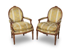 A pair of French 19th century walnut fauteuils or armchairs in the Louis XVI style (2)