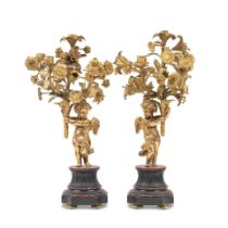 A pair of late 19th century French gilt bronze figural five light garniture candelabra (2)