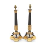 A pair of late 19th/early 20th century gilt and patinated bronze lamp bases probably French, in ...