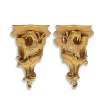 A pair of 19th century carved and gilt gesso wall brackets In the George II style (2)