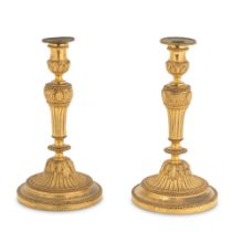 A pair 19th century French gilt bronze candlesticks in the Louis XVI style (2)