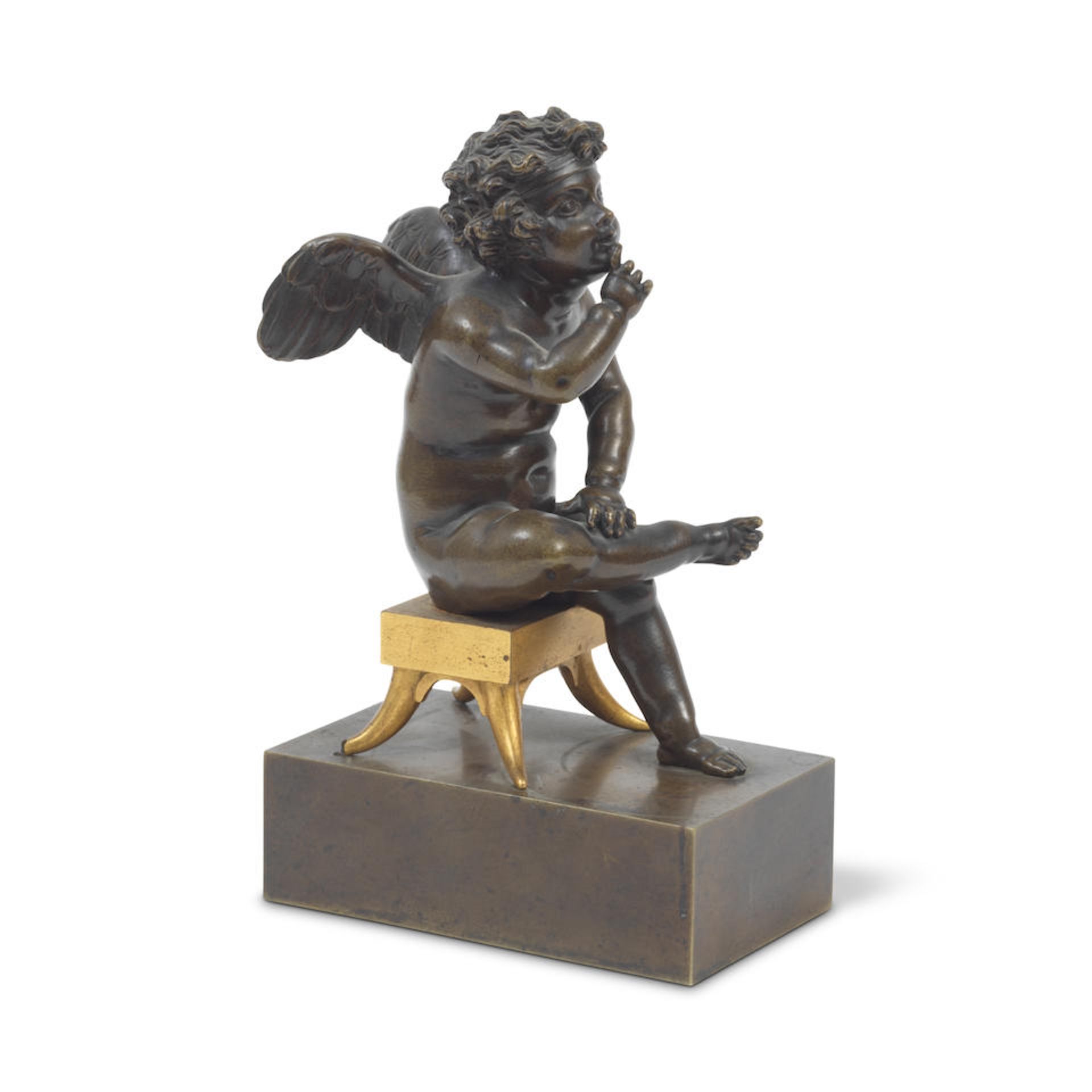 An early 19th century French gilt and painted bronze figure of Cupid