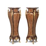 A pair of French early 20th century gilt bronze mounted rosewood, bois satine, tulipwood, amaran...