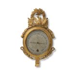 An early 19th century French carved gilt wood wall barometer the dial signed for Selon Torricelli