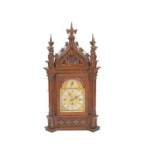 A late Victorian oak chiming table/bracket clock in the Gothic style,