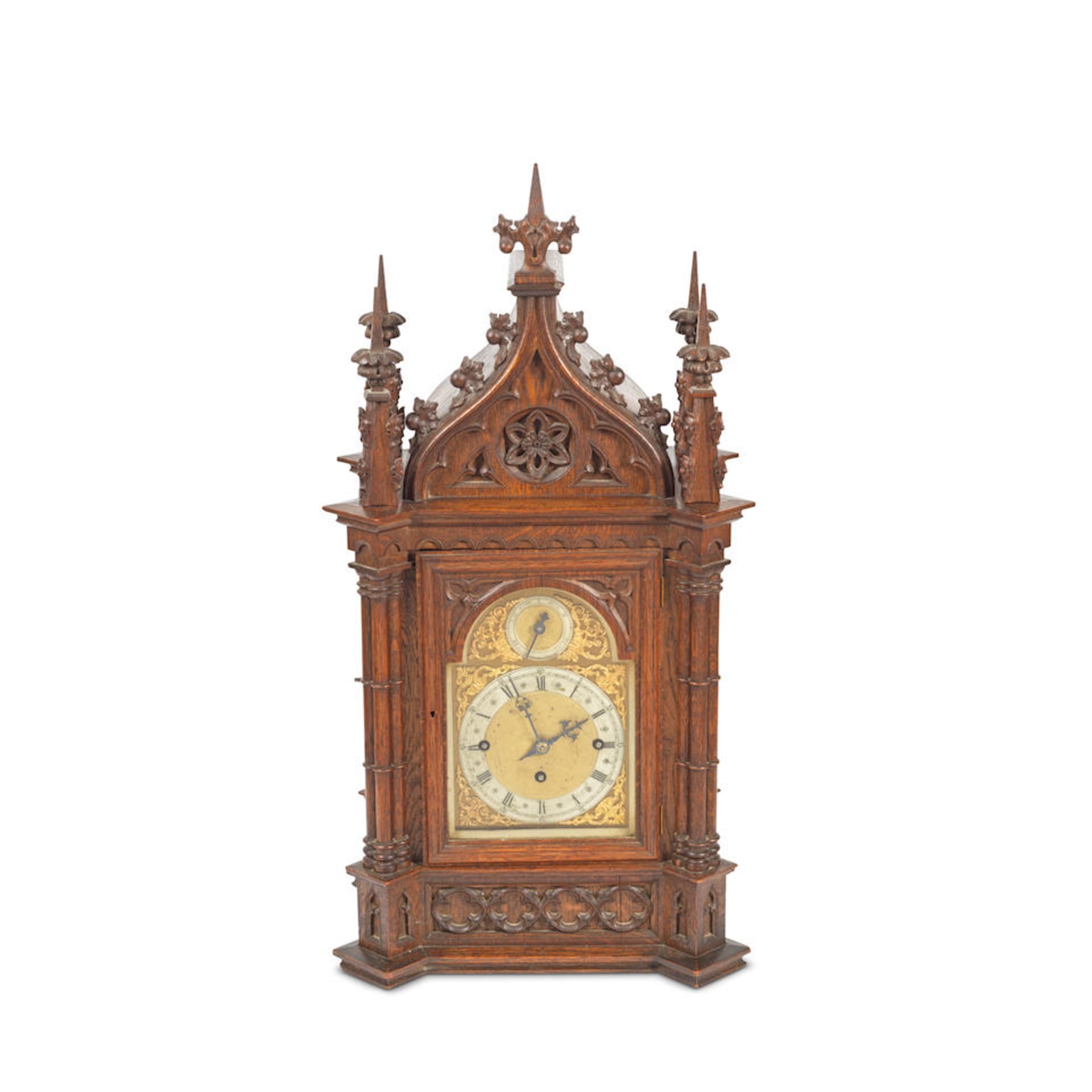 A late Victorian oak chiming table/bracket clock in the Gothic style,