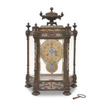 A late 19th century / early 20th century French champlevé enamel four glass clock the dial...