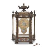 A late 19th century / early 20th century French champlevé enamel four glass clock the dial...
