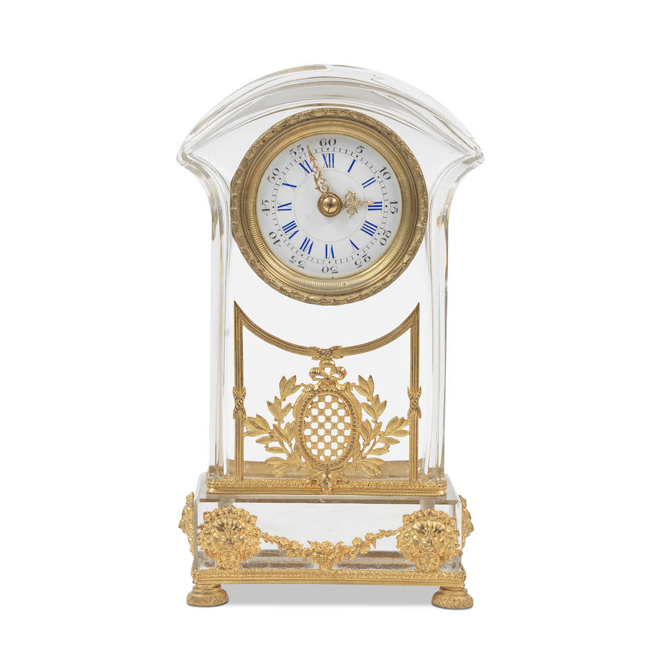 An early 20th century French gilt brass mounted moulded and cut glass boudoir timepiece the glas...