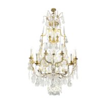 An impressive sixteen-light gilt brass and cut and moulded glass cage chandelier in the Louis XV...