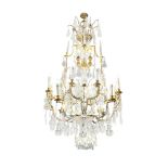 An impressive sixteen-light gilt brass and cut and moulded glass cage chandelier in the Louis XV...