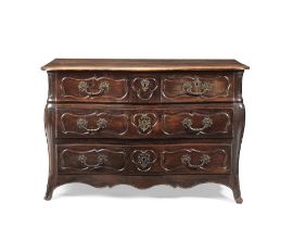 An 18th century French Provincial Louis XV stained beech serpentine commode