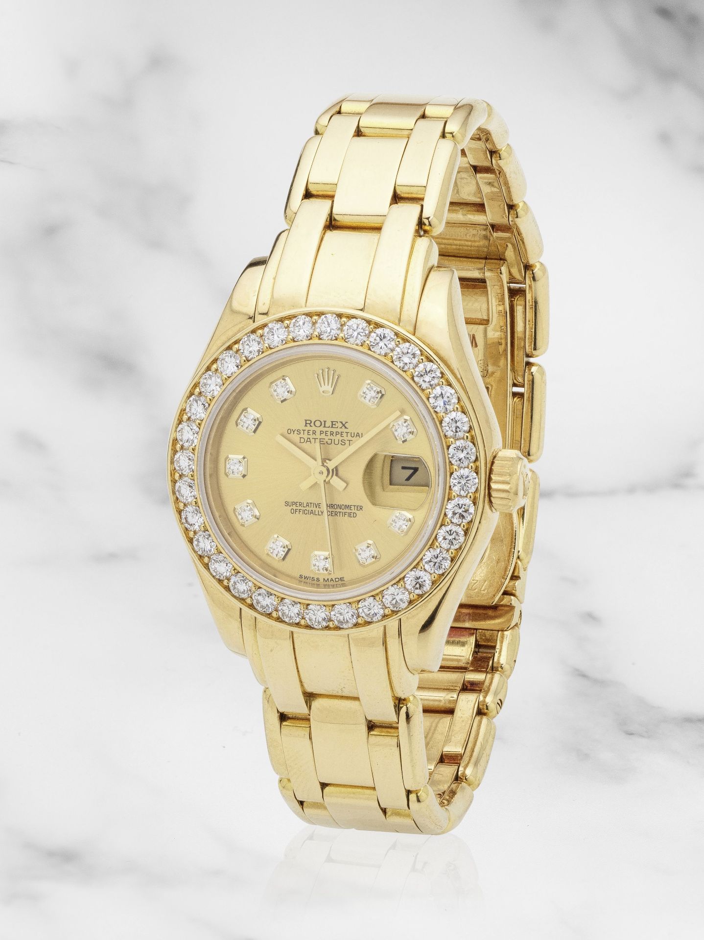 Rolex. A lady's 18K gold and diamond set automatic calendar bracelet watch Rolex. Montre bracele...