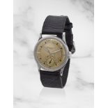 Patek Philippe. A fine and rare stainless steel manual wind wristwatch retailed by Hausmann & Co...