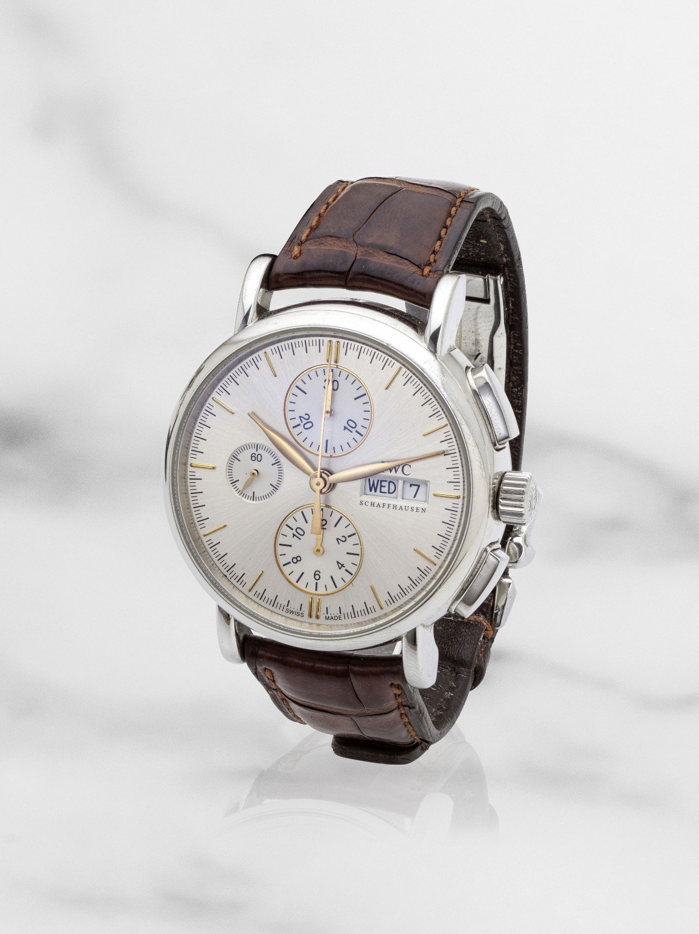 IWC. A stainless steel automatic calendar chronograph wristwatch IWC. Chronographe bracelet en a...