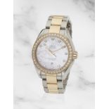 Omega. A lady's 18K rose gold and stainless steel diamond set automatic bracelet watch Omega. Mo...