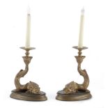 A pair of gilt bronze dolphin form lustre candlesticks in the 19th century style (2)