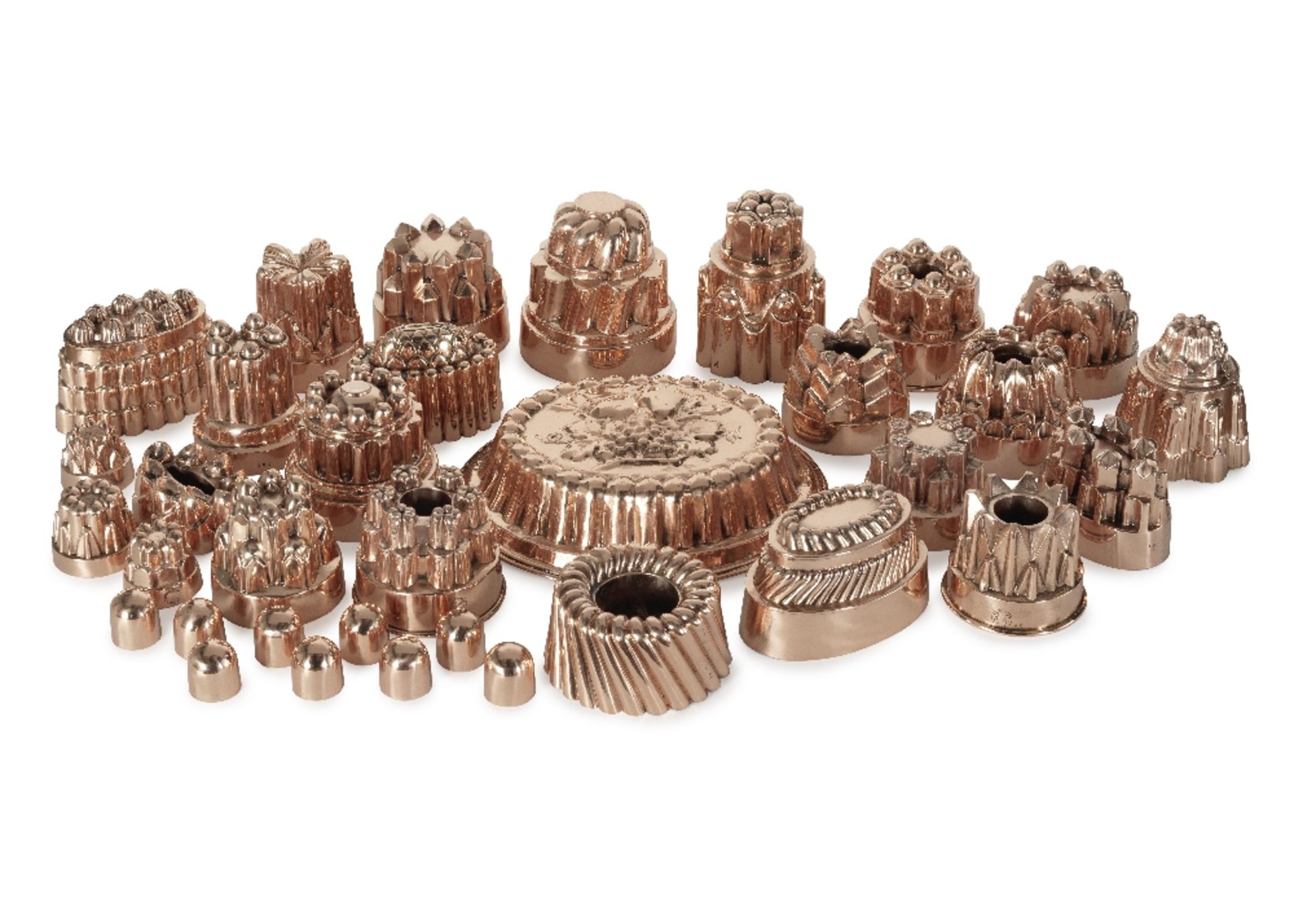 A good collection of thirty four 19th century copper jelly and confectionary moulds, the majorit...