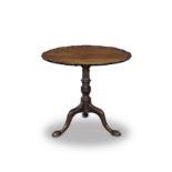 A mahogany tripod table George III period with what appears to be a later associated top