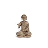 A Burmese gilt copper alloy figure of a monk probably 19th century