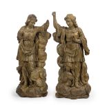 A pair of Southern European carved and giltwood double-sided figures of standing angels probabl...