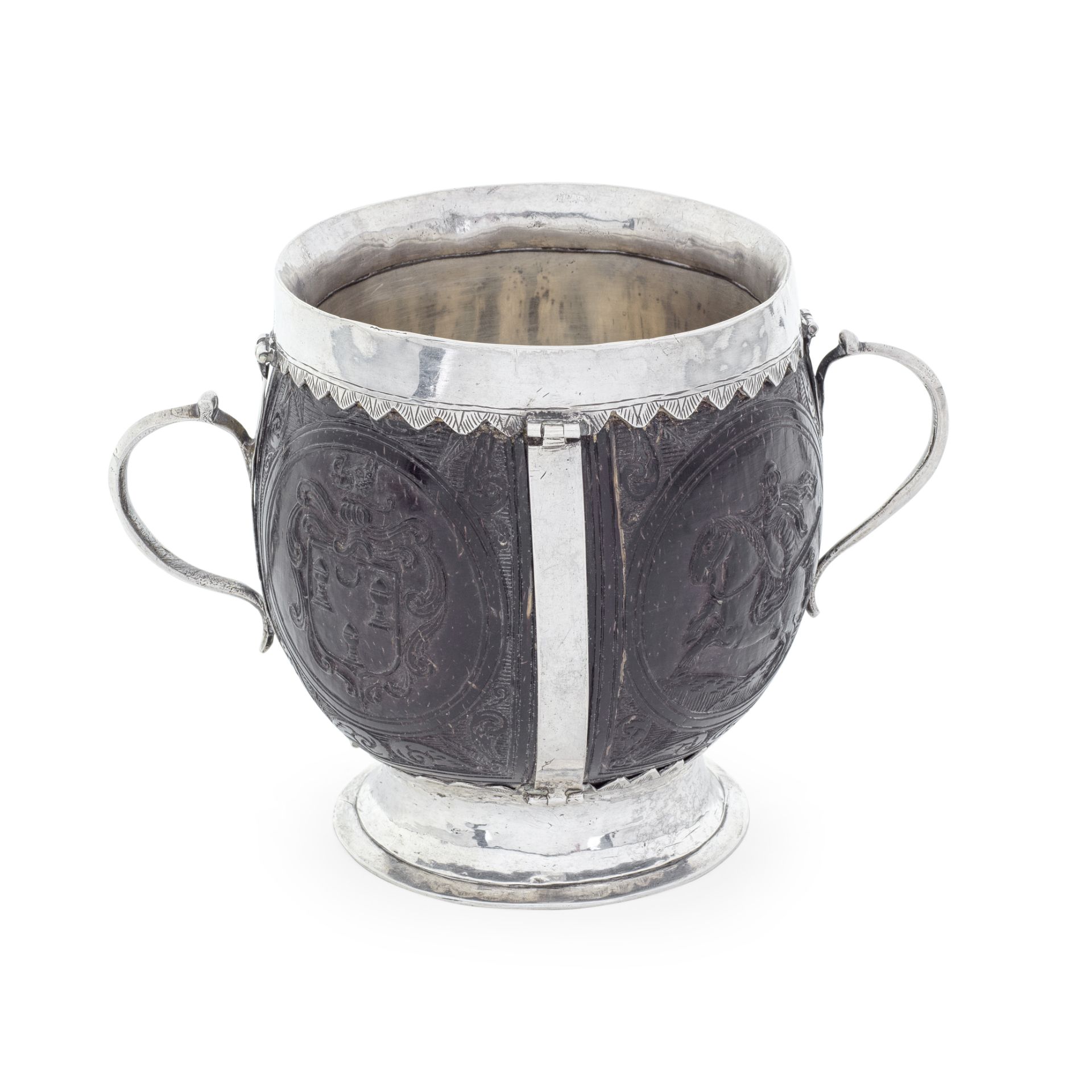 HISTORICALLY IMPORTANT: a 17th century Irish silver mounted twin-handled coconut cup unmarked